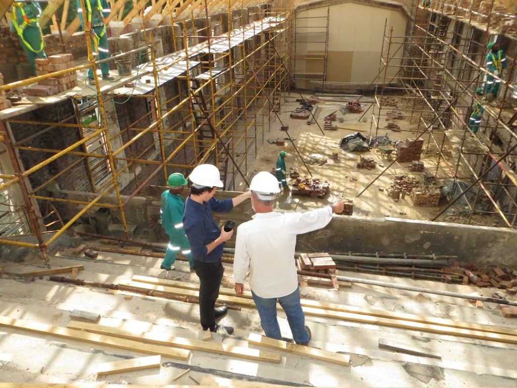 Two workers discussing next steps in project